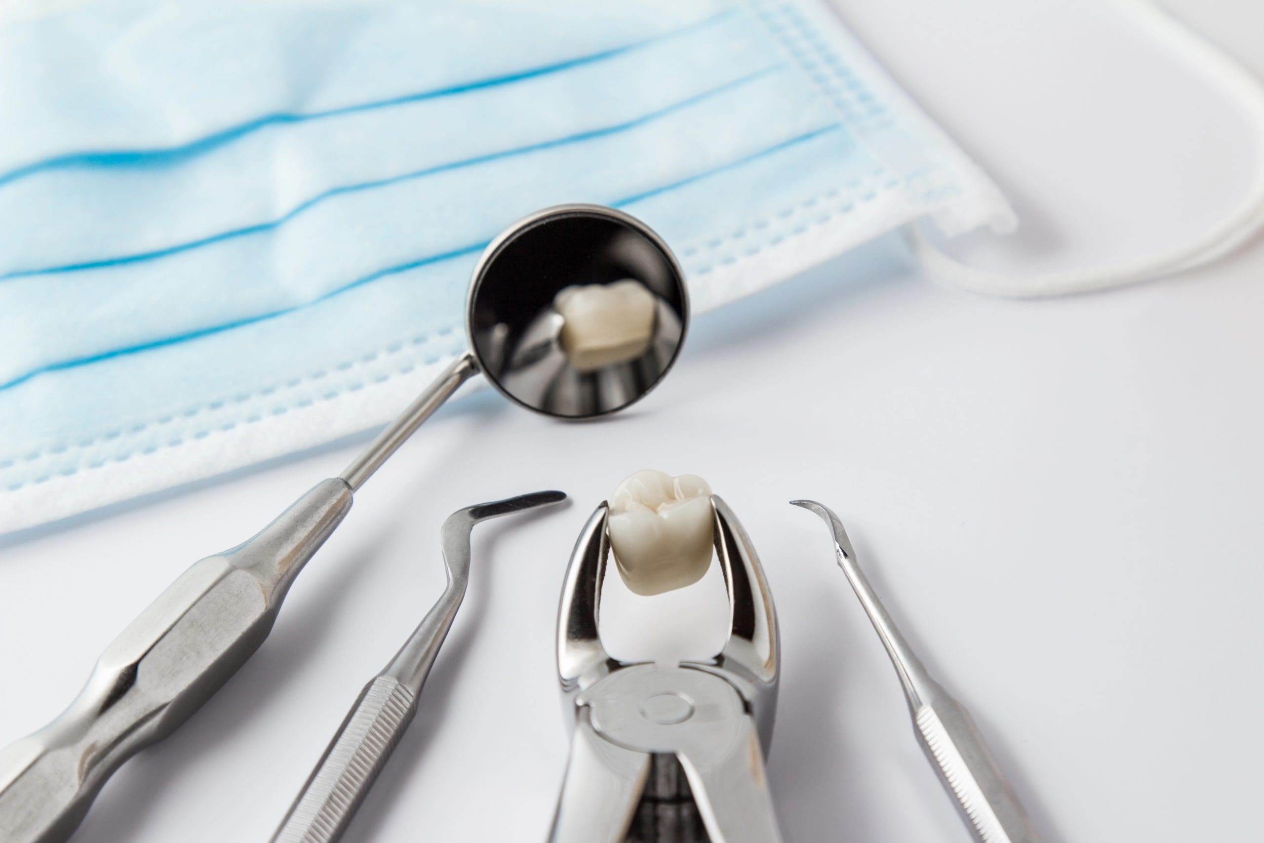 Why are space maintainers used after tooth extraction?